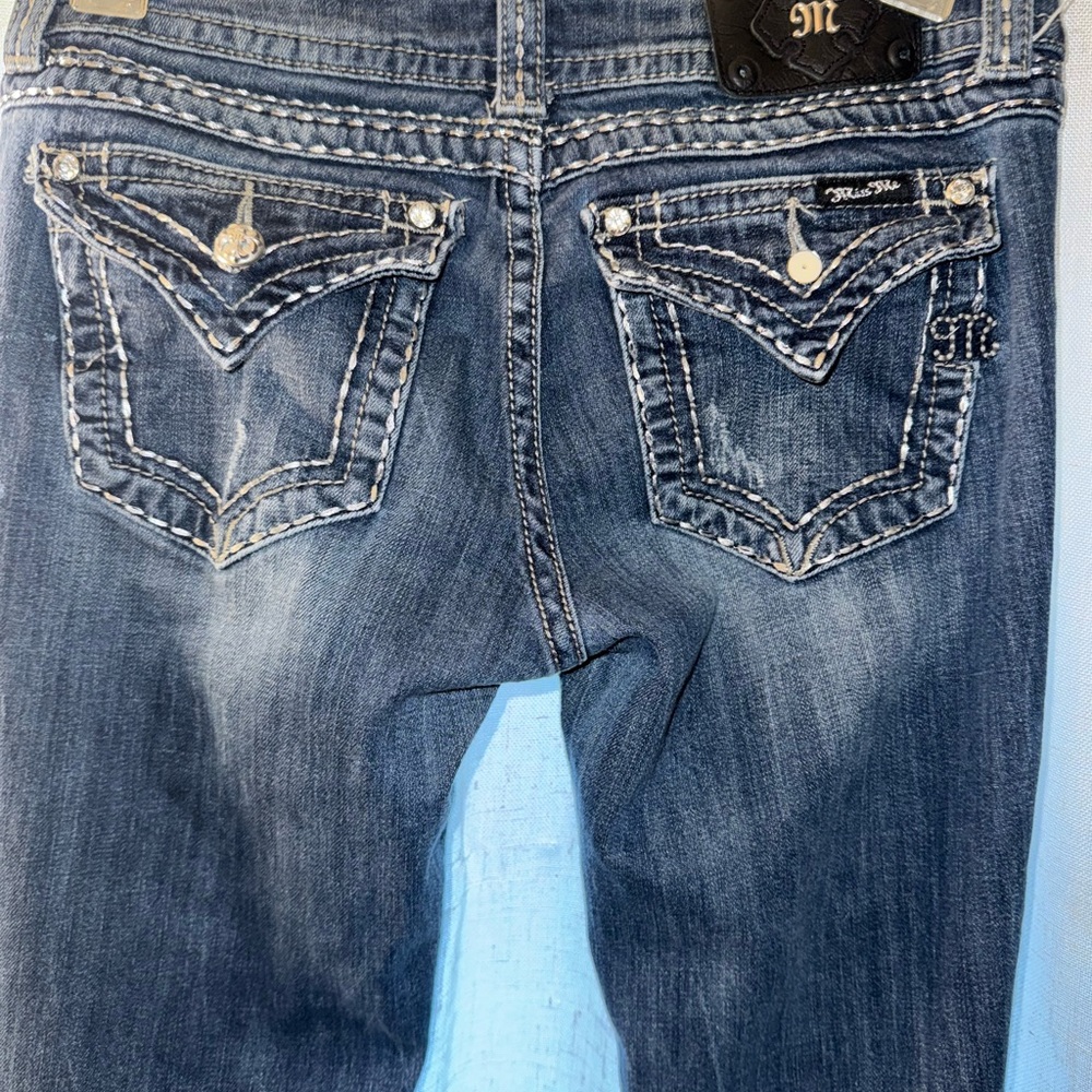 Miss Me Blue Jeans with Ornate Stitching and Distressed Finish. Size 31 Long.